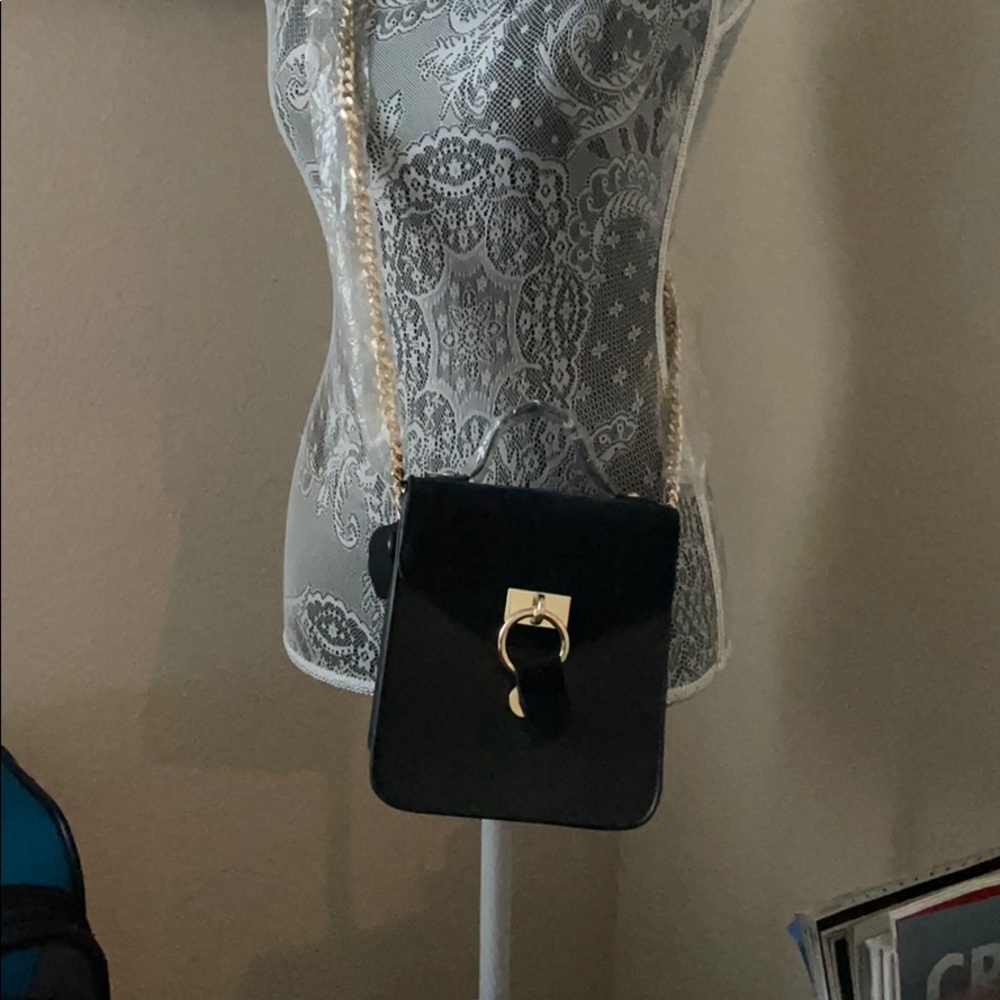 Beautiful black  purse with gold accent chain